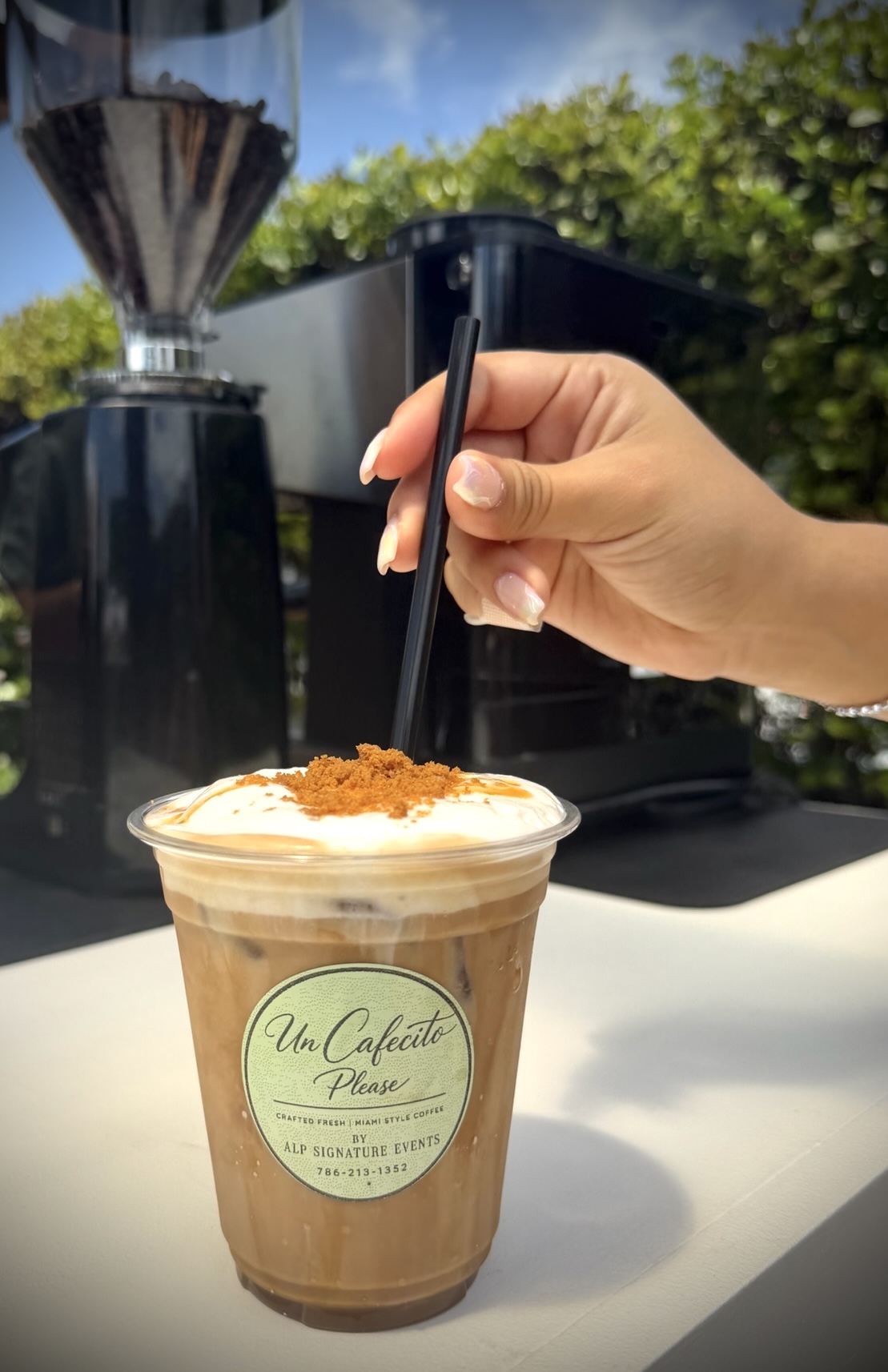 Iced latte with caramel and speculoos crumble